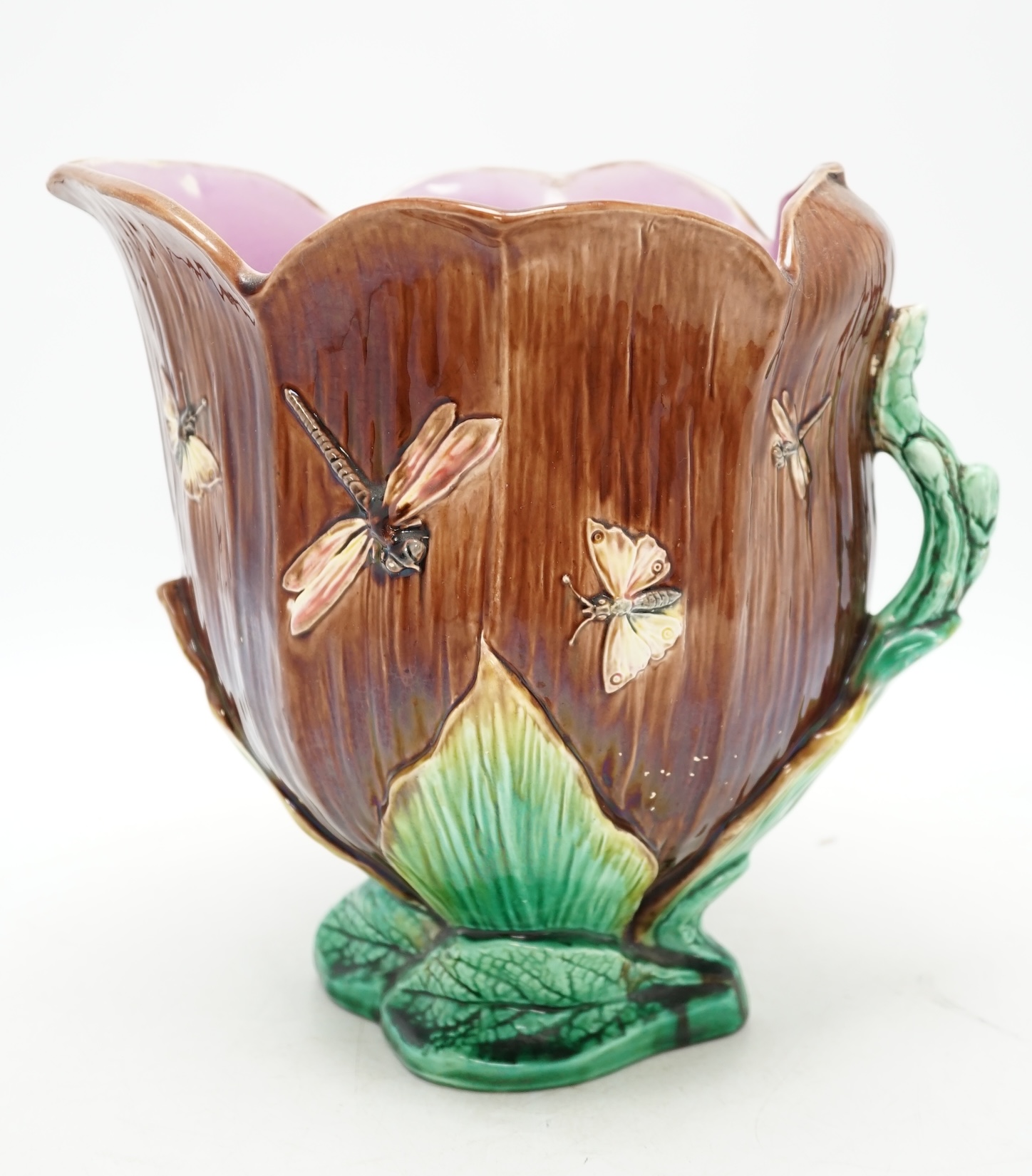 A large Victorian majolica jug, 26cm. Condition - fair